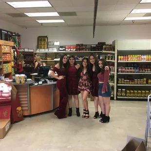 a group of women standing in front of a counter