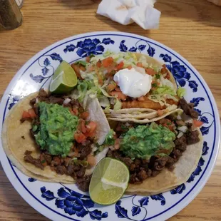 Two Carne asada tacos and one fish taco