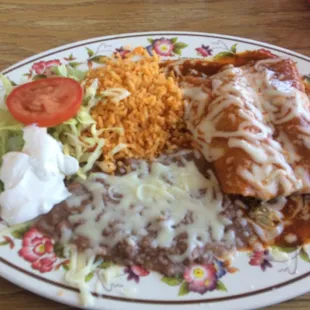 Chicken enchiladas with rice and beans