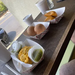 left to right: papa rellena with ají, buñuelos and empanadas.
