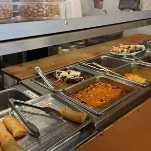 The turo-turo style layout of the various dishes.