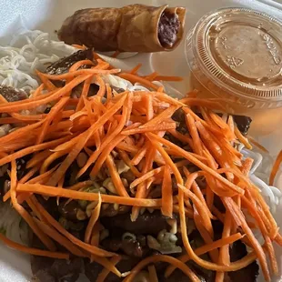 Pork and noodle salad with crispy egg roll