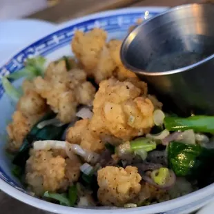 a blue and white bowl of food