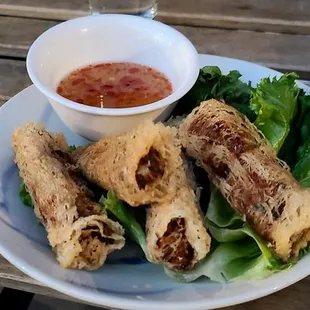 a plate of food on a wooden table