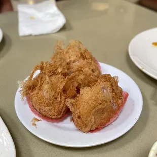 a plate of fried food on a table