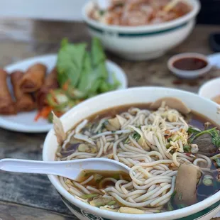 a bowl of noodle soup with a spoon
