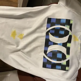 Ruined shirt by employee spilling mustard on my son