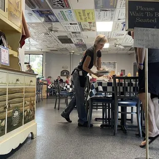 a woman walking through the store