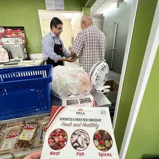 two men in a kitchen