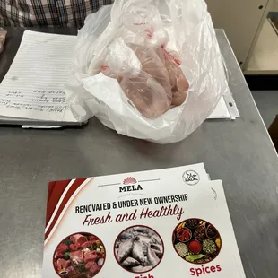 a man holding a bag of meat