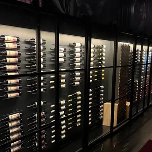 rows of wine bottles in a wine cellar