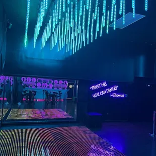 a dance floor with neon lights