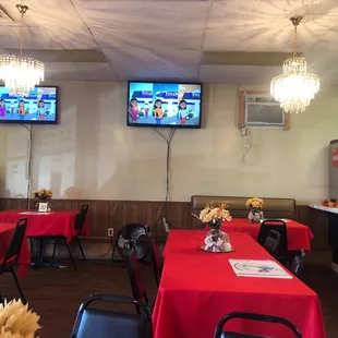 a restaurant with red tablecloths and red tablecloths