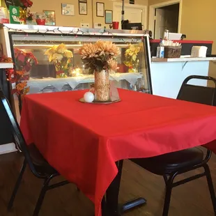 a table with a red tablecloth