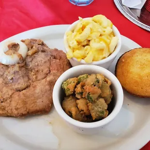 Smothered pork chops with mac n cheese, fried okra, and cornbread