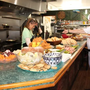 a man serving food to a woman