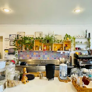 a woman standing in a coffee shop