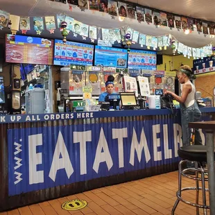 a woman standing at the counter