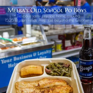 a tray of food and a bottle of beer
