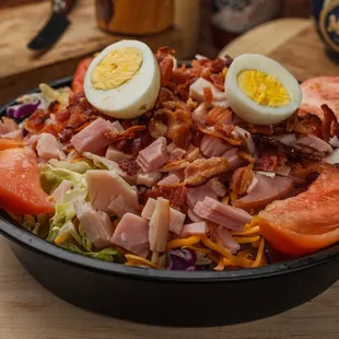 a salad with hard boiled eggs and ham