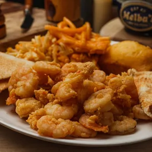a plate of fried shrimp and toast