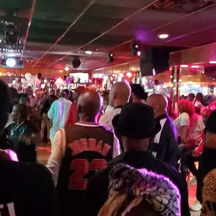 a crowd of people at a party