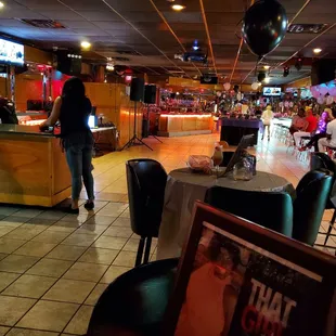 a woman walking through a restaurant