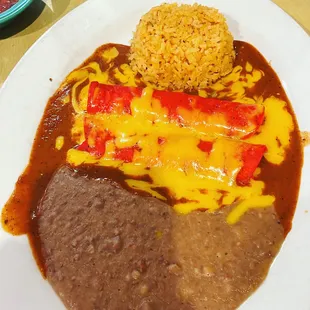 a plate of mexican food with rice and beans