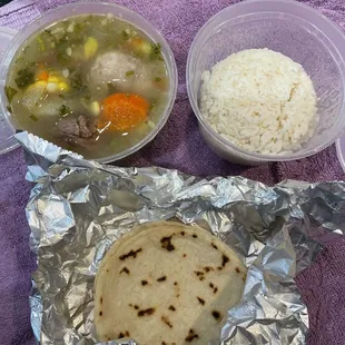 Soup comes with rice and a tortilla