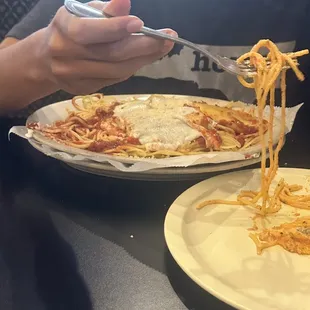 Manicotti over spaghetti