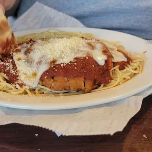 a plate of spaghetti and meat