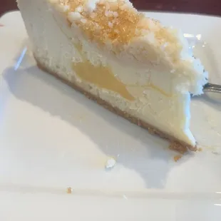 a slice of lemon drop cheesecake