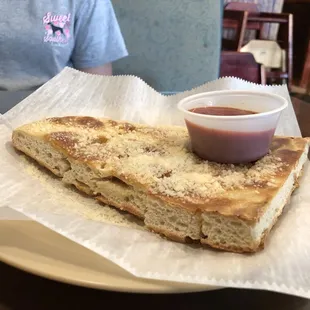 a half eaten sandwich on a plate