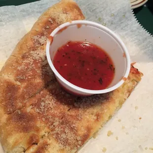 Warm bread and sauce to munch on till entrees come.