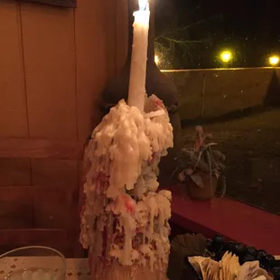 a candle in a bottle