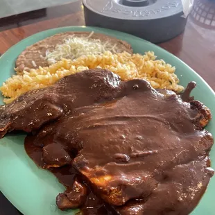 Chicken mole (comes with rice beans and flour tortillas) I asked for no bones so it's perfectly prepared to become tacos