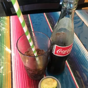 Green straws with Mexican Coca Cola