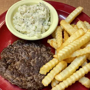 Hamburger steak, French fries and coleslaw.