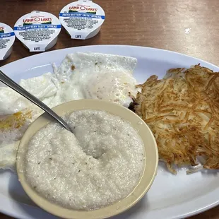 Two eggs OE grits and hash browns.
