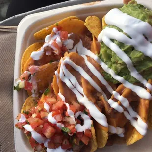 a plate of nachos and guacamole