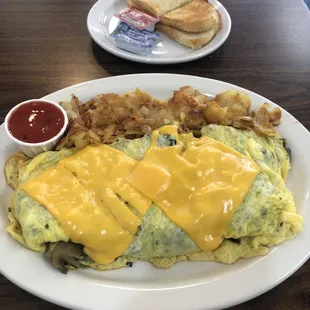 My massive build your own omelette w potatoes &amp; sourdough toast.