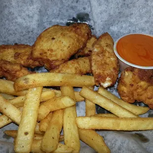 Chicken tenders and fries..yum! Lightly breaded white meat chicken. SO GOOD!