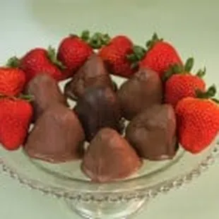 a bowl of chocolate covered strawberries