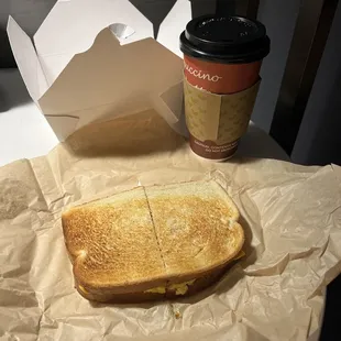 Large coffee, bacon, egg and cheese on sourdough.