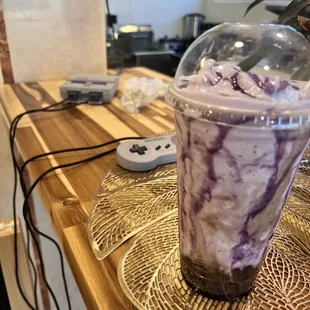 a purple drink on a table