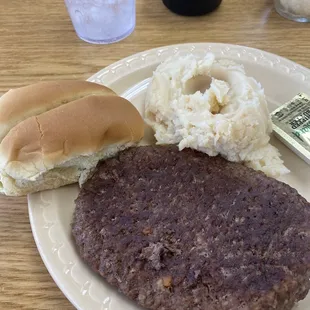 a hamburger and mashed potatoes