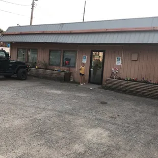 a man standing in front of a building