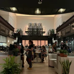 Walking up the entrance stairs.. look how beautiful!! The floors! The light! The plants!!