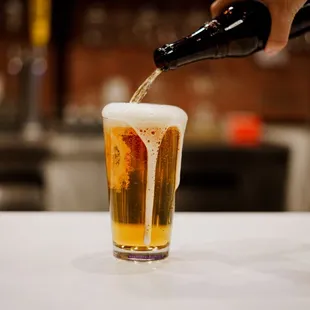 a beer being poured into a glass