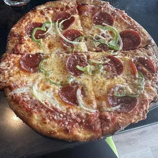 Build your own. Thin crust with pepperoni, green pepper and onion.